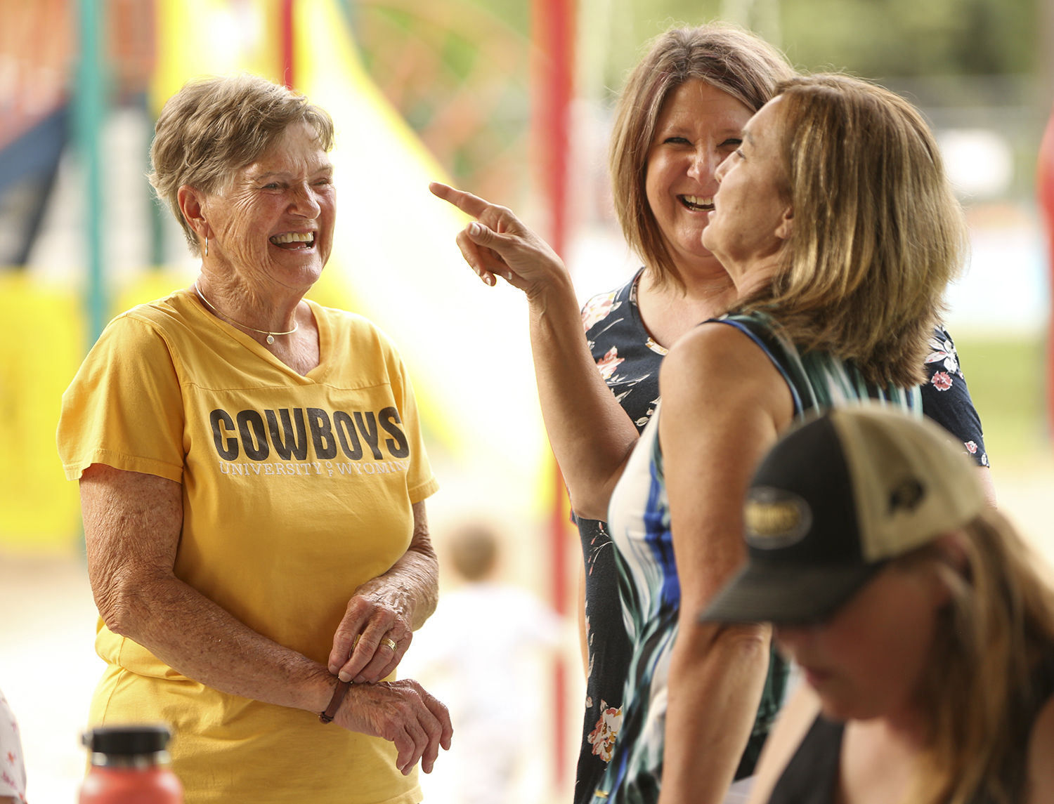 Linda Metzer laughs with the original creator of the group Marcy Schueler and Heidi Toyne